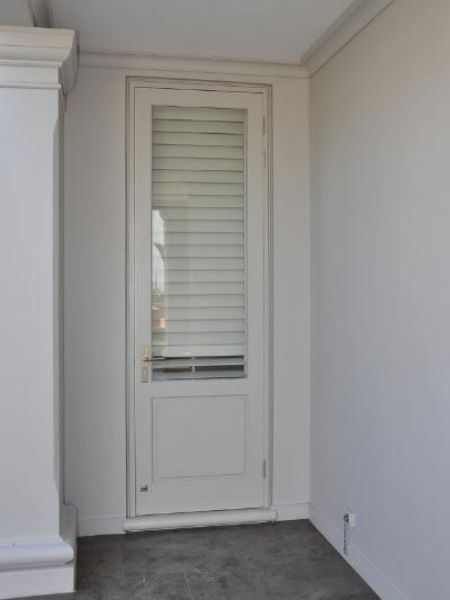 Picture of the Full Pane Top Solid Bottom 813 mm x 2032 mm Exterior Door shown installed and viewed from inside a building