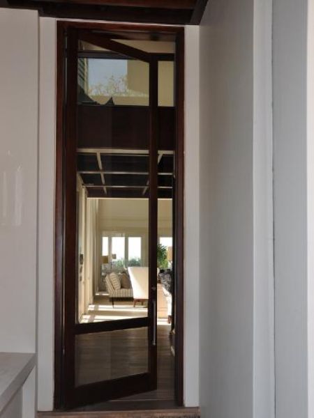 Picture of the Full Pane with Safety Rail 813 mm x 2032 mm Patio Door with hardware and installed in a doorframe, shown open